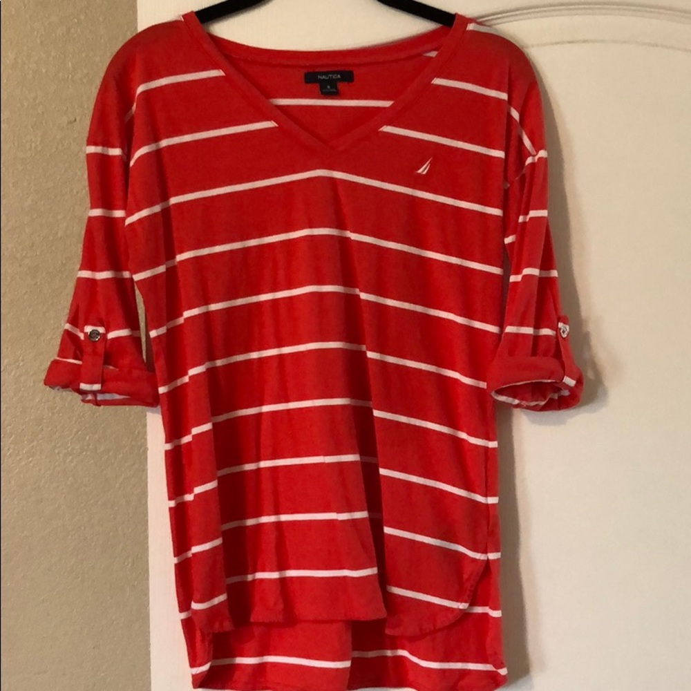 Striped coral colored Nautica shirt.
